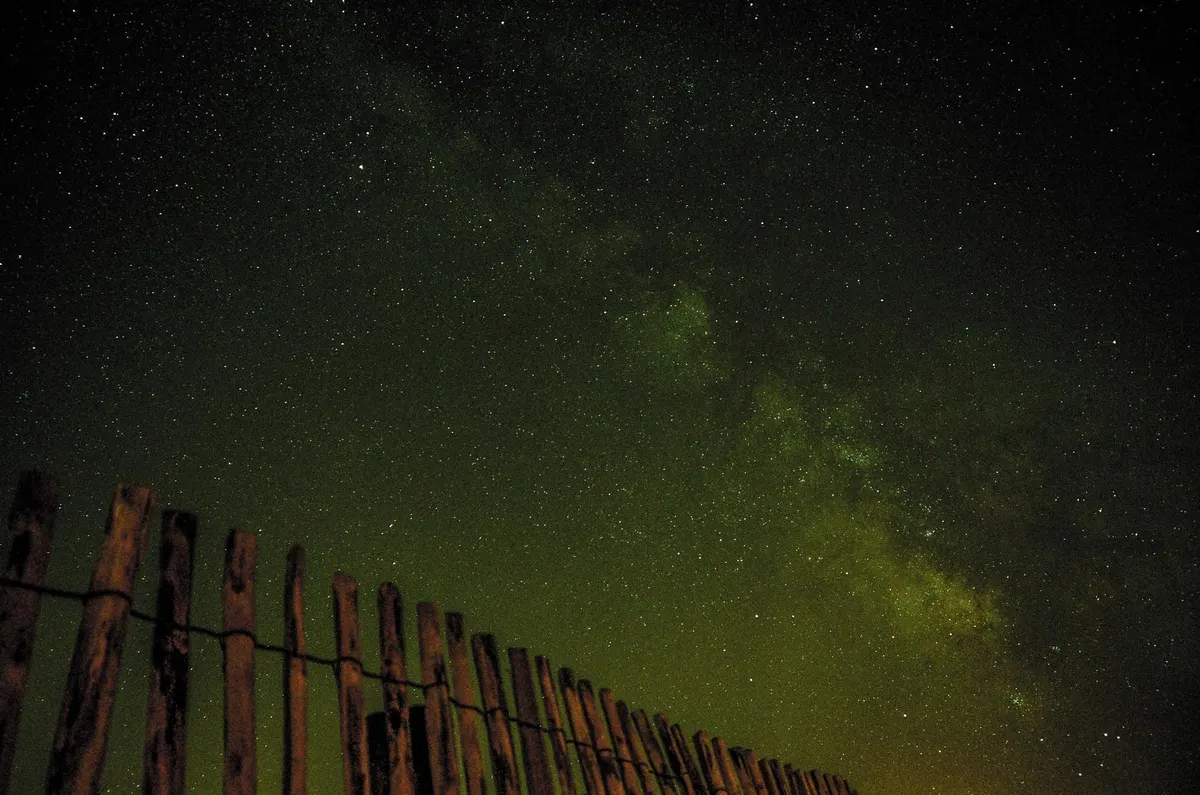 Northern lights over the fence